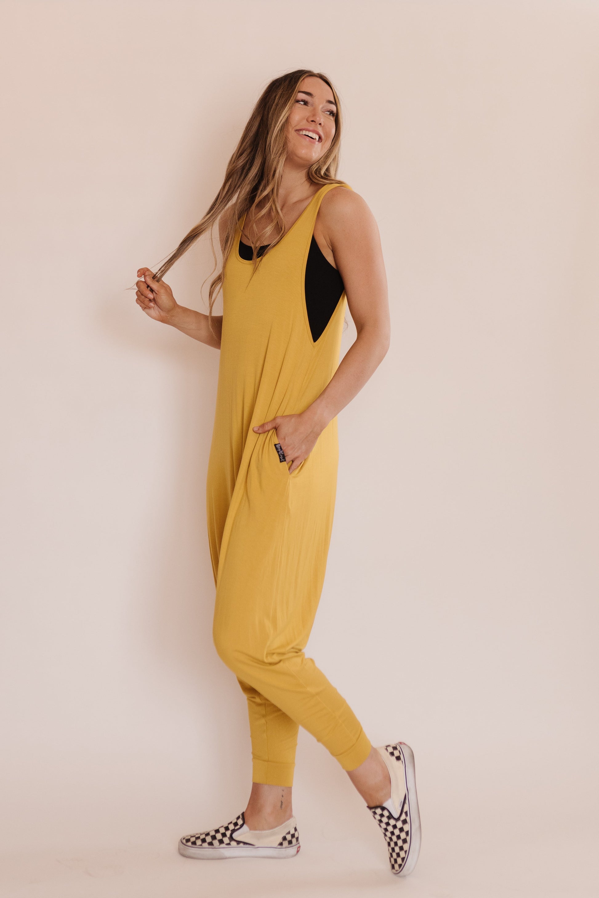 Momper Romper jumpsuit in mustard yellow.