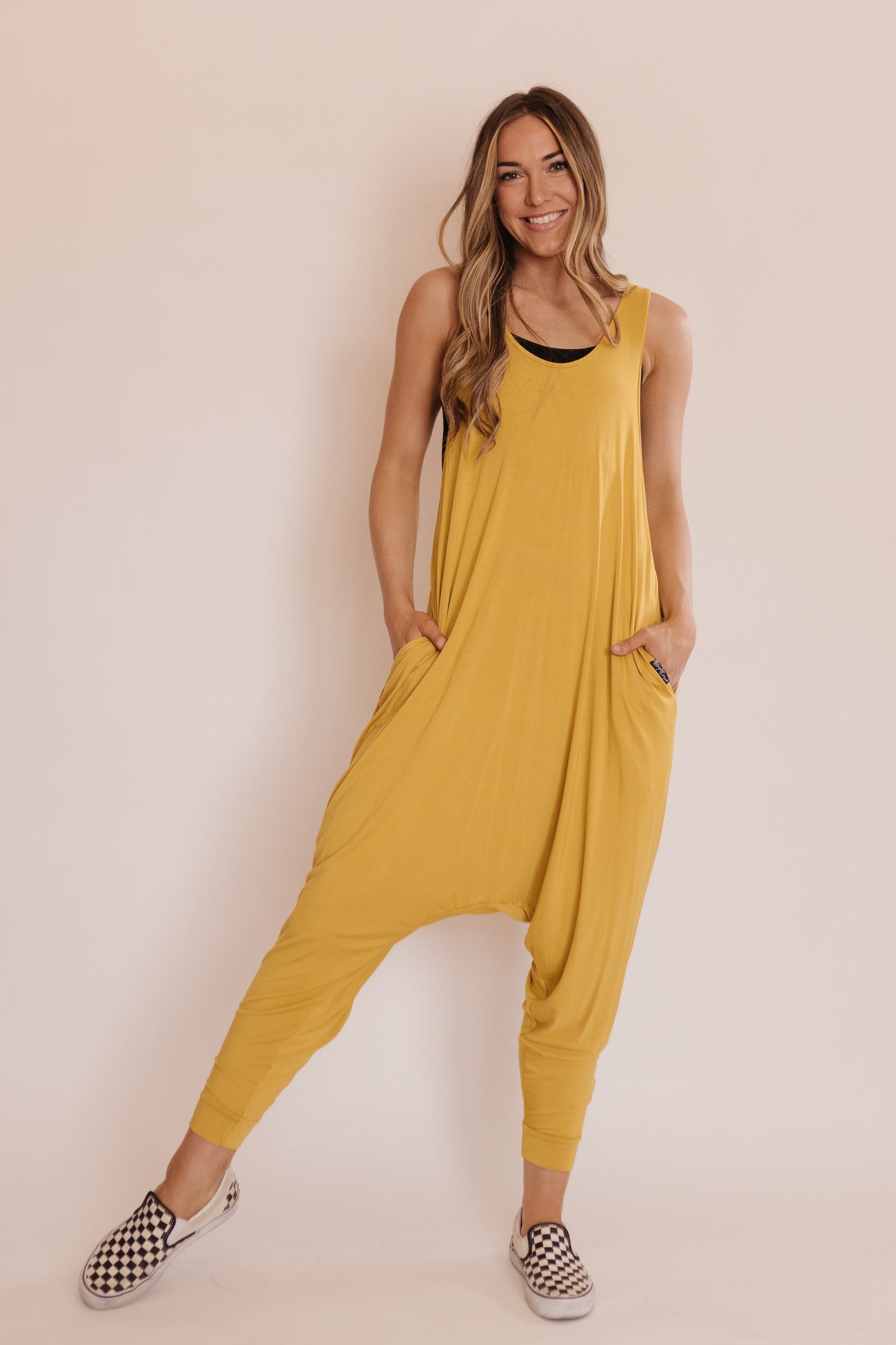 Momper Romper jumpsuit in mustard yellow.