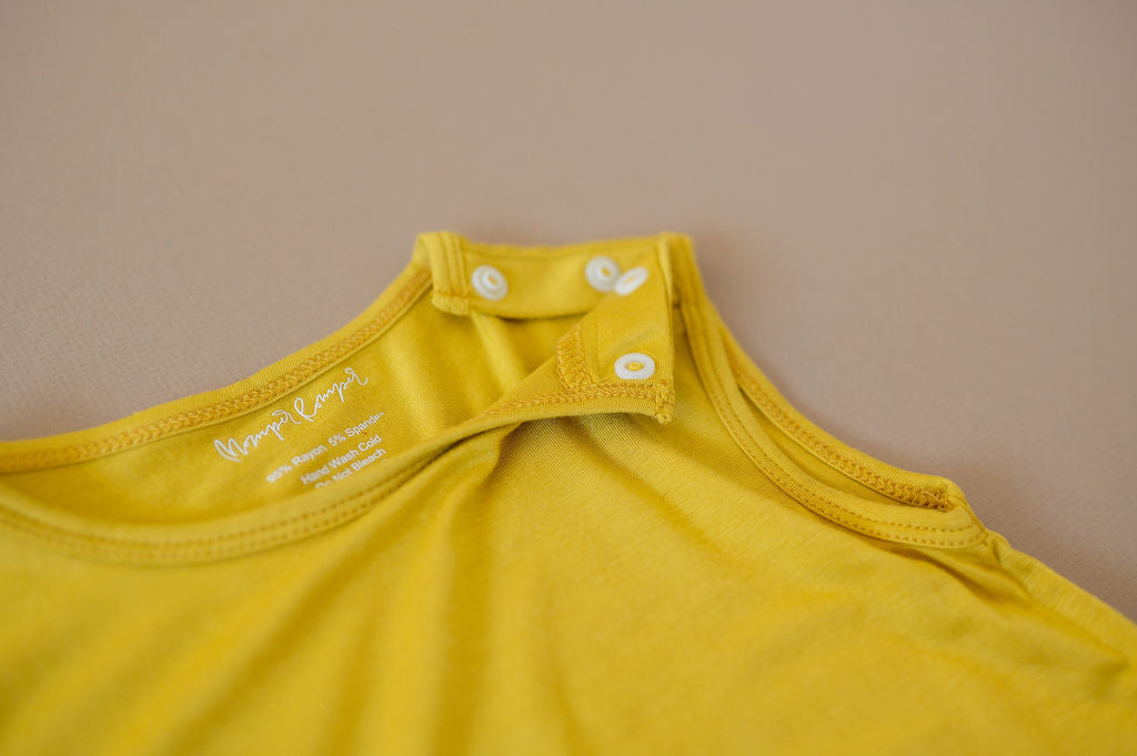 Mustard yellow baby Momper Romper.
