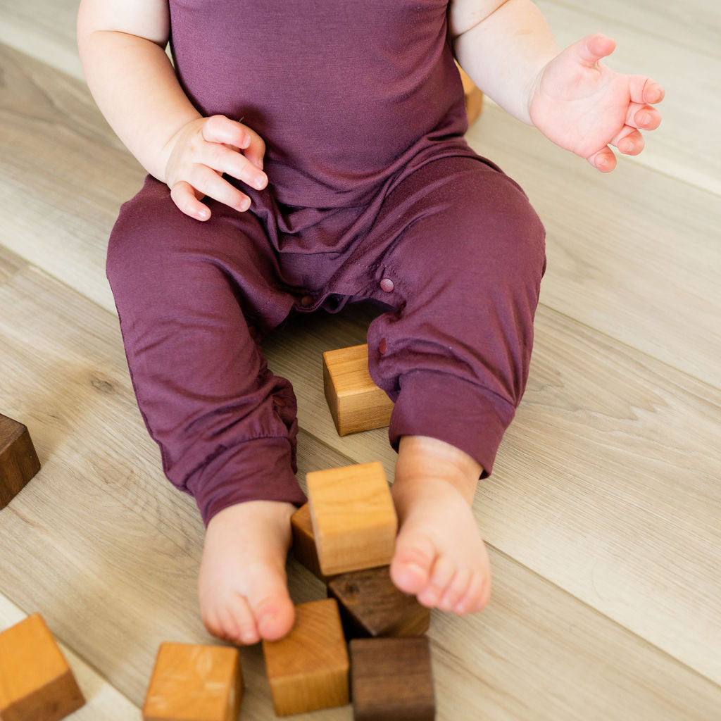 Baby Momper Romper in desert rose purple.