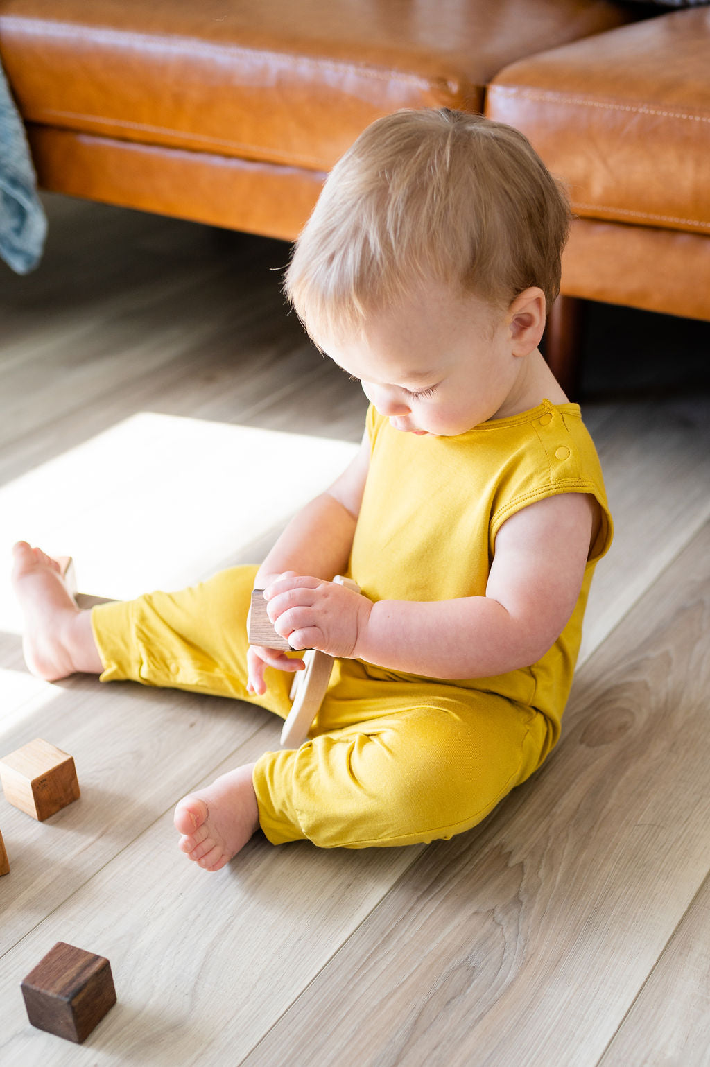 Mustard yellow baby Momper Romper.