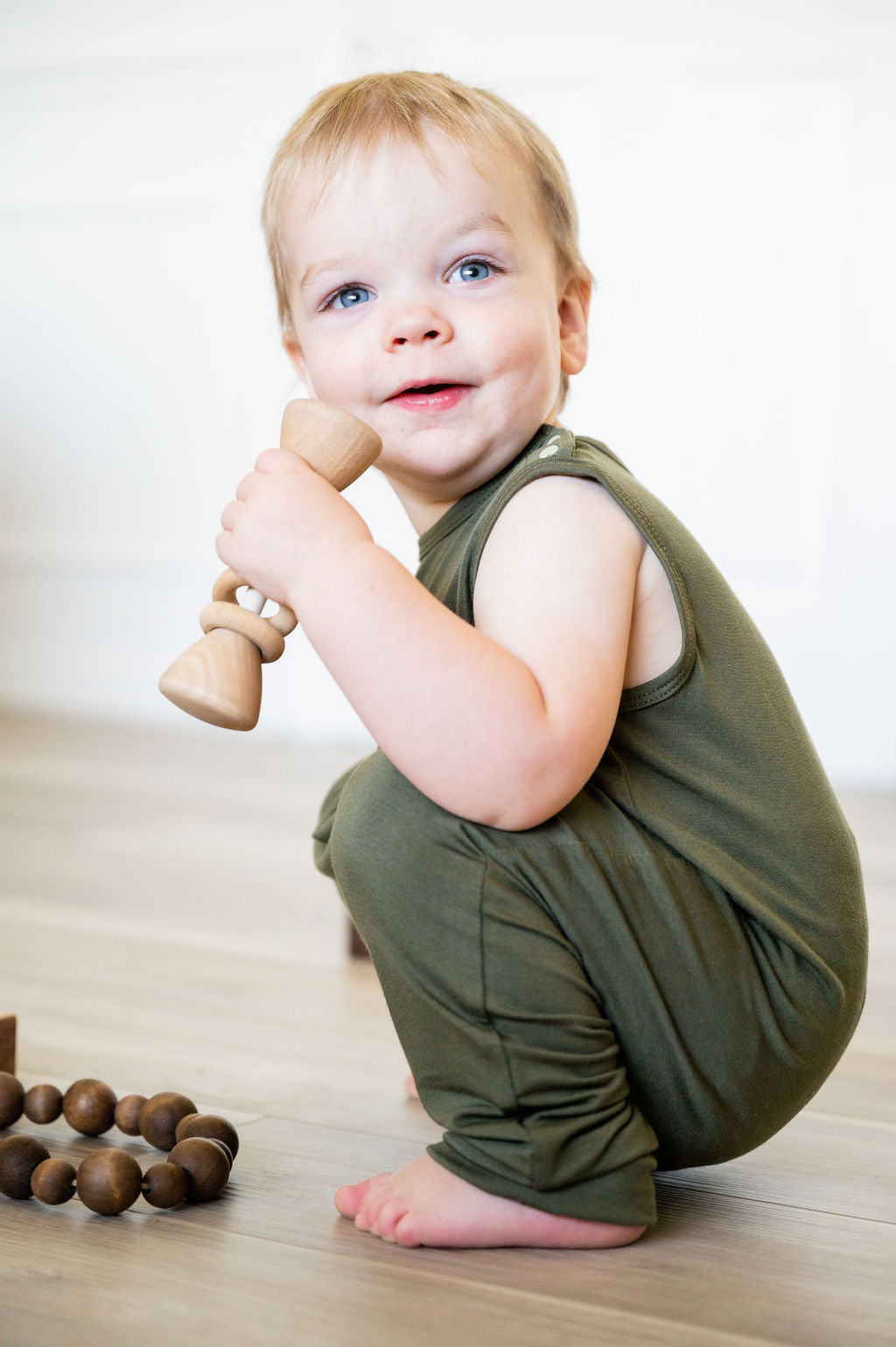 Olive green baby Momper Romper.
