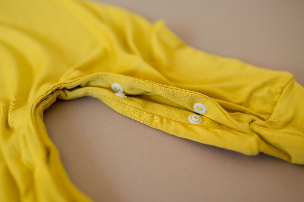 Mustard yellow baby Momper Romper.